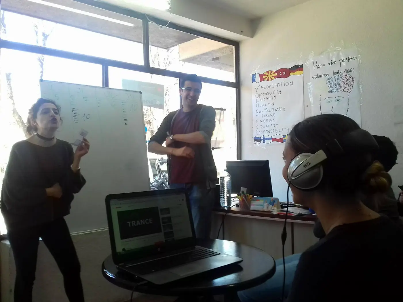 A workshop at the EVEC office in Kocani, with a flipchart headed How the perfect volunteer looks like